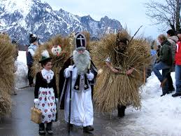 St Nicholas, his helper and the straw-men Buttnmandl in Berchtesgaden